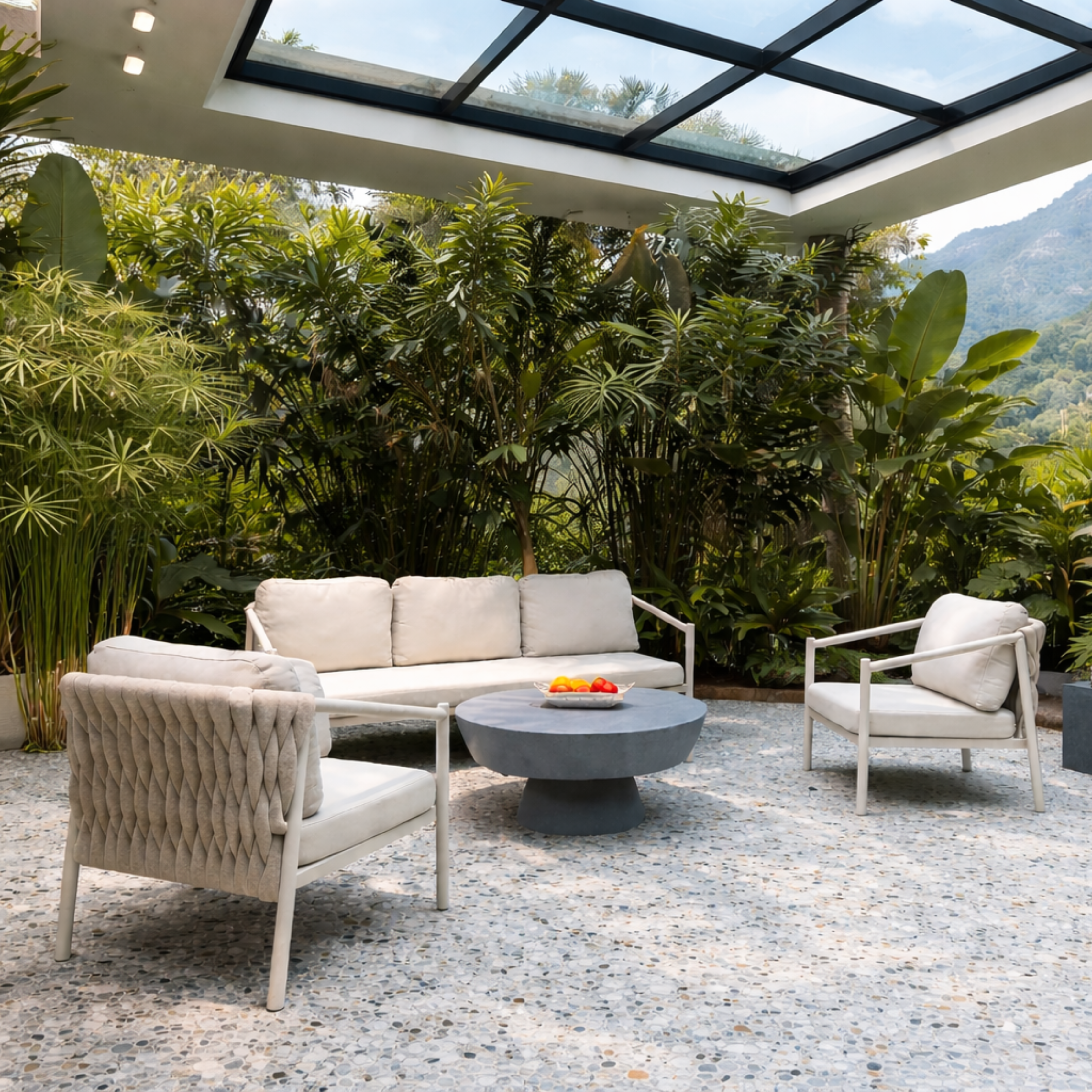 Outdoor patio with sleek sofa set with a concrete center table.