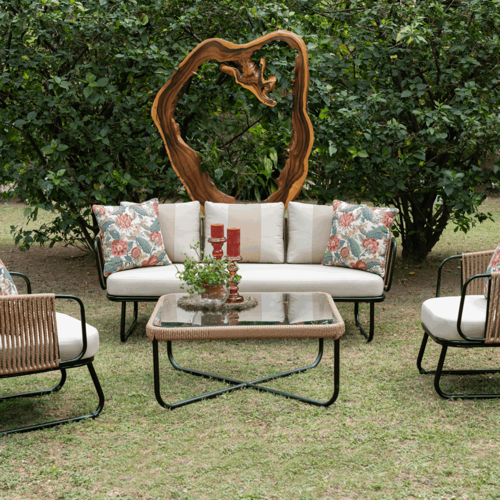 Outdoor center table madeup of metal framework that has nylon weaving and glass top
